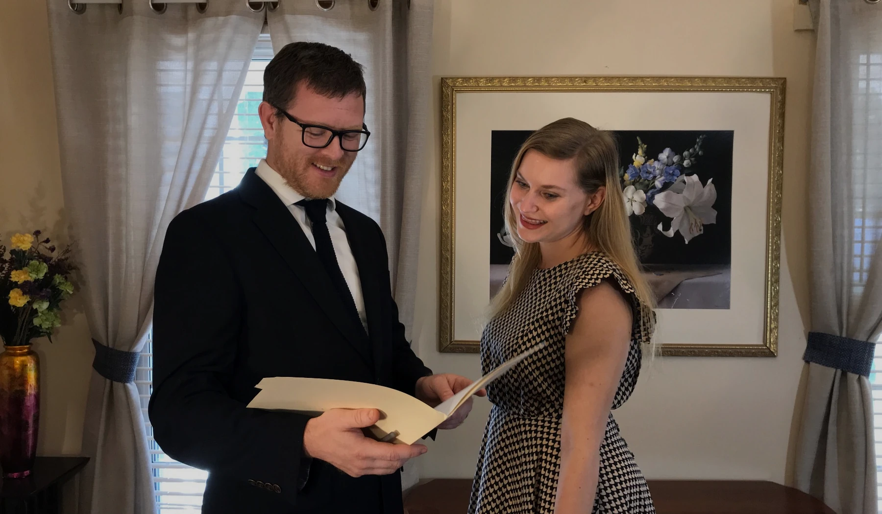 Michael Berelc reviewing legal documents with a client